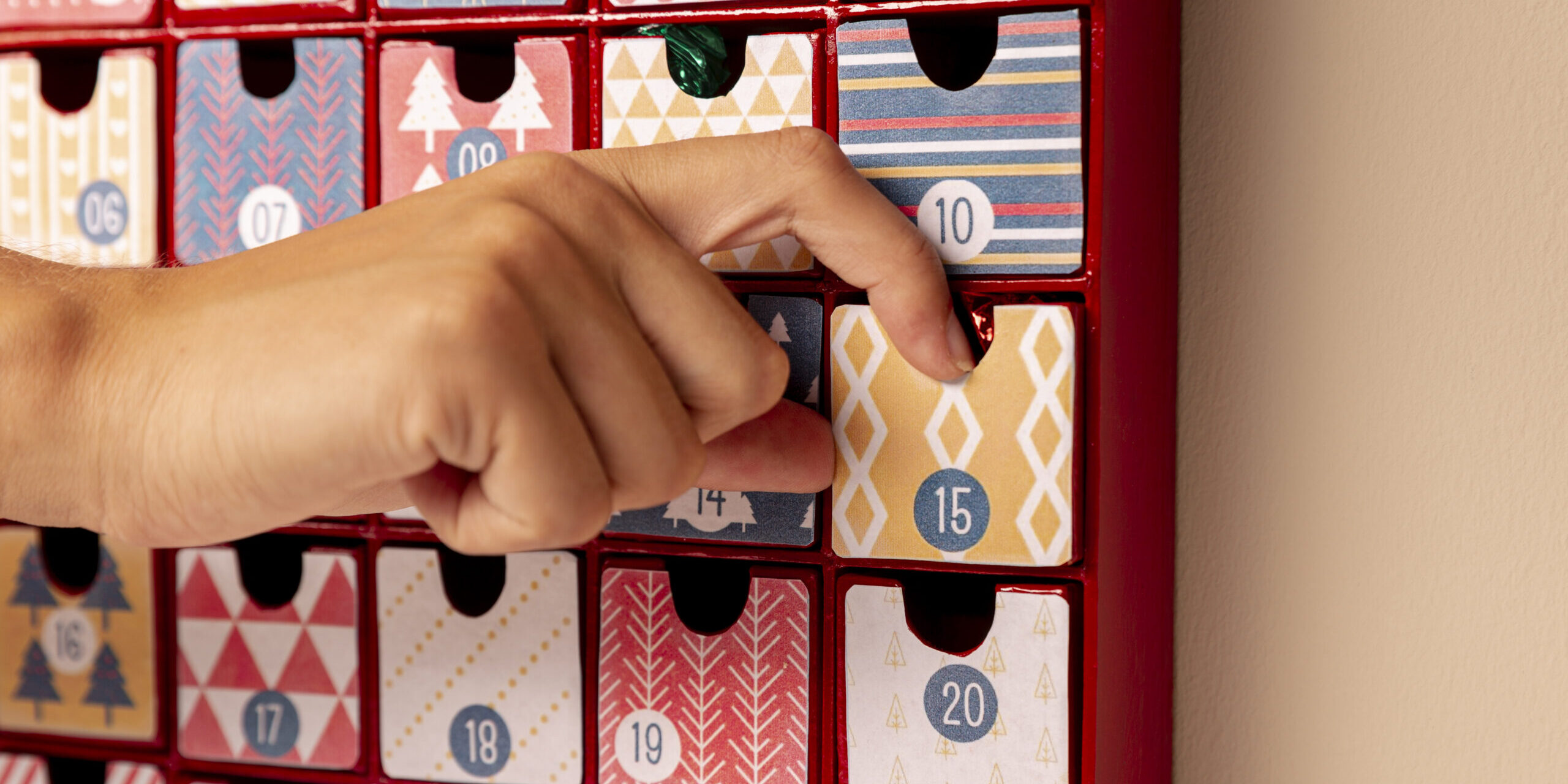 front-view-hand-checking-advent-calendar