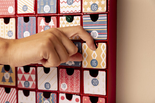 front-view-hand-checking-advent-calendar