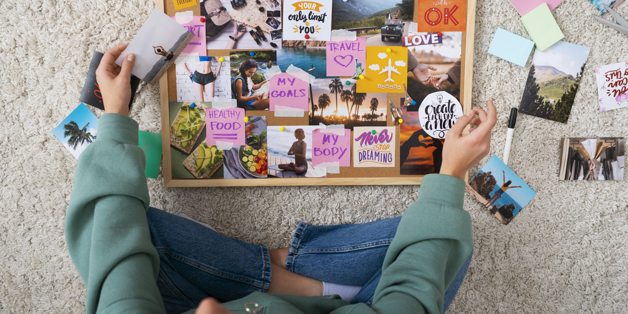 woman-creating-inspiring-vision-board-top-view